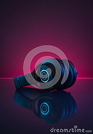 Wireless Gamer Headphones Dark Background and Neon Light. Stock Photo