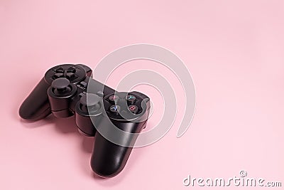 Wireless modern joystick gamepad on pink background, video game concept. Copyspace for text Stock Photo