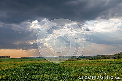 Wisconsin farmland with sunrays coming out of the clouds in September Stock Photo