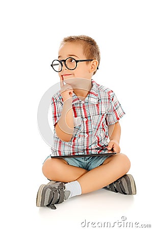 Wise little boy with tablet pc Stock Photo