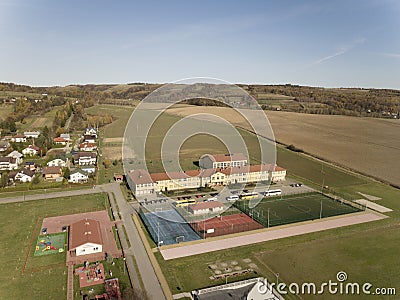 Wisniowa, Poland - 9 10 2018:Open school sports complex. Panorama of playing fields from a bird`s flight. Aerial photography from Editorial Stock Photo