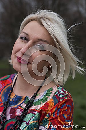 Wistful middle aged woman posing Stock Photo