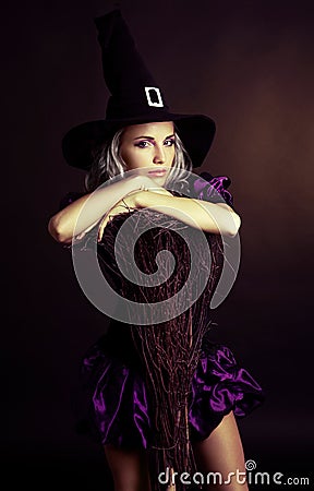 Witch with a broom Stock Photo