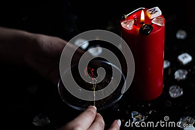 Witch burning magic herbs Stock Photo