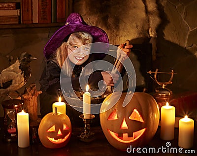 Witch with pumpkin lantern. Stock Photo