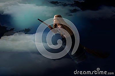 Witch with white hair flies in a mortar with broom in the night sky Stock Photo