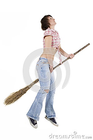 Witch young fly with broom Stock Photo