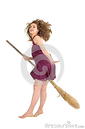Witch young fly with broom Stock Photo