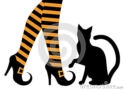 Witches feet in shoes and a black cat Stock Photo