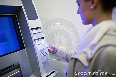 Withdrawing money from ATM Stock Photo