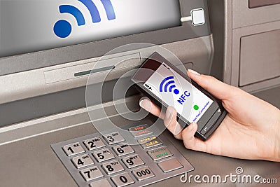 Withdrawing money atm with mobile phone a NFC terminal Editorial Stock Photo