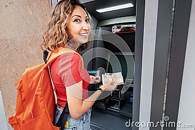Withdraws Armenian drams cash from an ATM. The concept of the exchange rate of currencies and loans Stock Photo