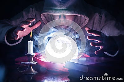 Sorcerer's Divination: Delving into the Secrets of the Crystal Ball Stock Photo