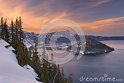 Wizard Island in Crater Lake in Oregon, USA at sunset Stock Photo