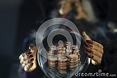 wizard toy holding a crystal ball, predicting wealth and lots of money Stock Photo