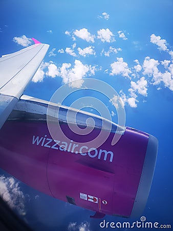 Wizzair plane wing and engine during flight Editorial Stock Photo