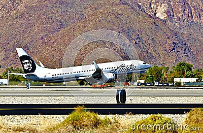 Alaska Airlines Boeing B-737-990ER(WL) taking off from Palm Springs, California Editorial Stock Photo