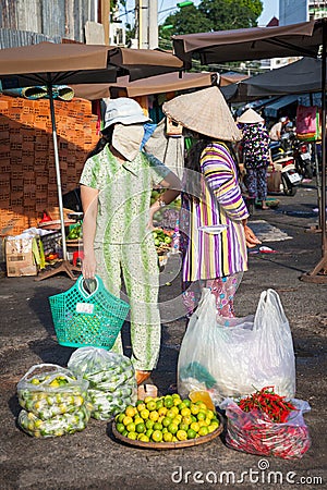 Wo vietnamese women are having a conversation at the street market, Nha Trang, Vietnam Editorial Stock Photo