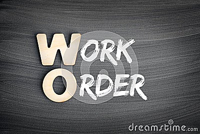 WO - Work Order acronym, business concept on blackboard Stock Photo