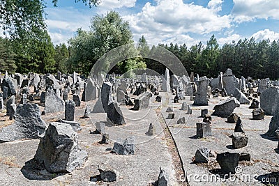 Lots of stones symbolising gravestones. Inscriptions indicate places of Holocaust train departures Editorial Stock Photo