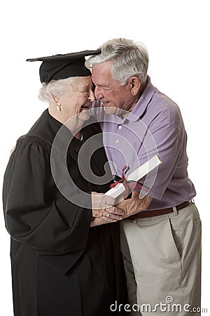 Beauitiful Caucasian woman in a black graduation gown Stock Photo