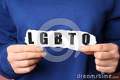 Woman with abbreviation LGBTQ, closeup Stock Photo