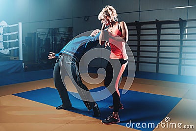 Woman in actoin on self-defense training Stock Photo