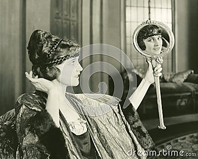 Woman admiring her hairstyle Stock Photo