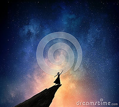 Woman against starry sky . Mixed media Stock Photo