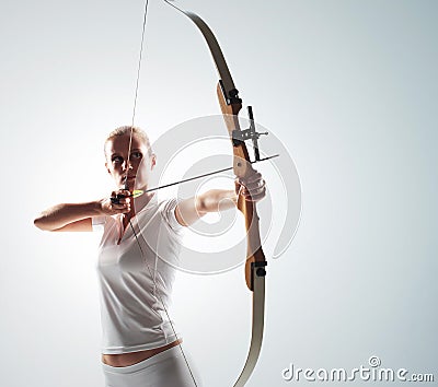 woman aiming with bow Stock Photo