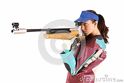 Woman aiming a pneumatic air rifle Stock Photo