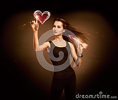 Woman Aiming to the Glowing Heart with an Arrow Stock Photo