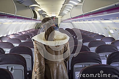 Woman in airplane Stock Photo