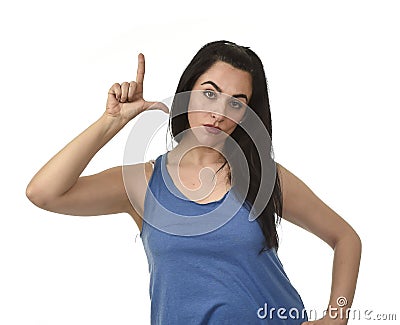 Woman angry upset and sad doing L sign with her fingers representing looser Stock Photo