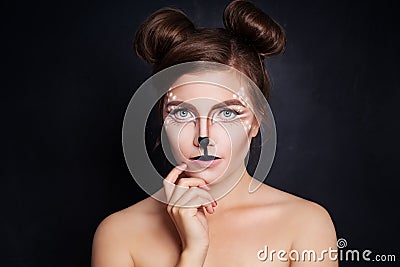 Woman Animal with Artistic Halloween Makeup on Black Stock Photo