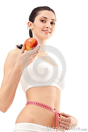 Woman with apple and measure tape Stock Photo