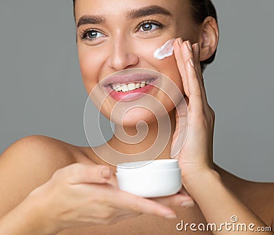 Woman Applying Beauty Eye Contour Wrinkle Cream Stock Photo