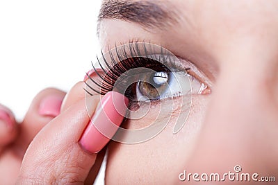 Woman applying false eyelashes Stock Photo