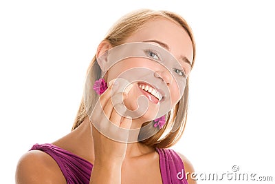 Woman applying foundation Stock Photo