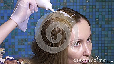 The Woman Applying Hair Coloring Dye at Home  Hair and Applies  Along a Hair Parting Mix from a Tube Stock Footage - Video of head, lady:  68488304