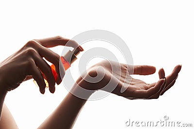 Woman applying perfume on her wrist Stock Photo