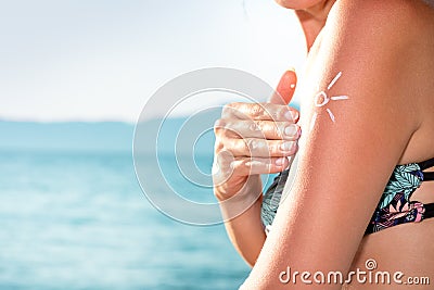 Woman applies a protective cream to her nourished skin Stock Photo