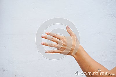 Woman arm and hand waving good bye. Stock Photo