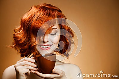 Woman with an aromatic coffee in hands Stock Photo