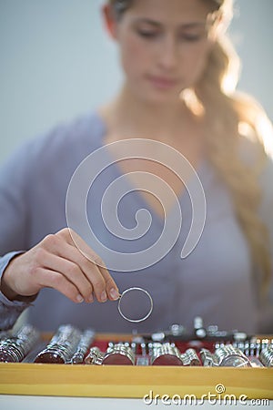 Woman arranging messbrille in tool box Stock Photo