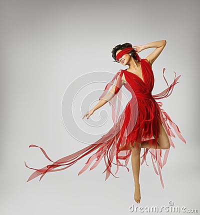 Woman Artist Dancing in Red Dress, Girl with Band on Eyes Stock Photo