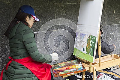 Woman artist painting in suzdal,russian federation Editorial Stock Photo