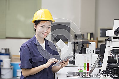 Woman asian engineer doing chemical test in laboratory Stock Photo