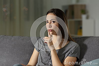 Woman asking for silence in the night at home Stock Photo