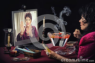 Woman asks to online psychic for hand prediction Stock Photo